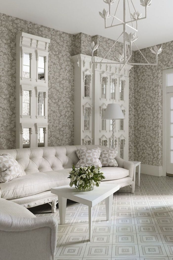 Finished residential living room with patterned wallpaper